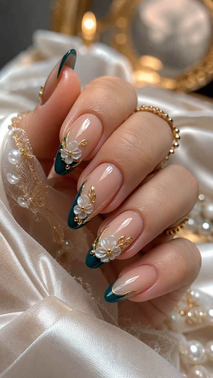 Emerald French nails with 3D white flowers and gold accents