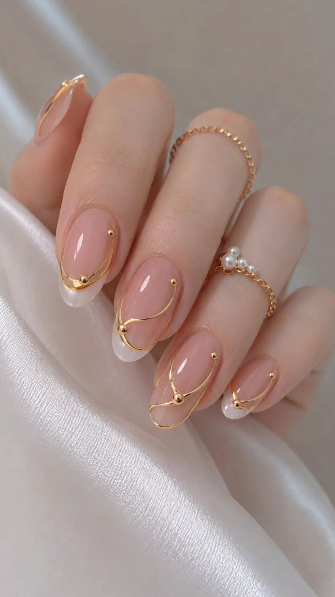 Almond gel manicure with gold line nail art